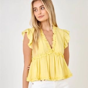 Bright yellow peplum ruffle top blouse